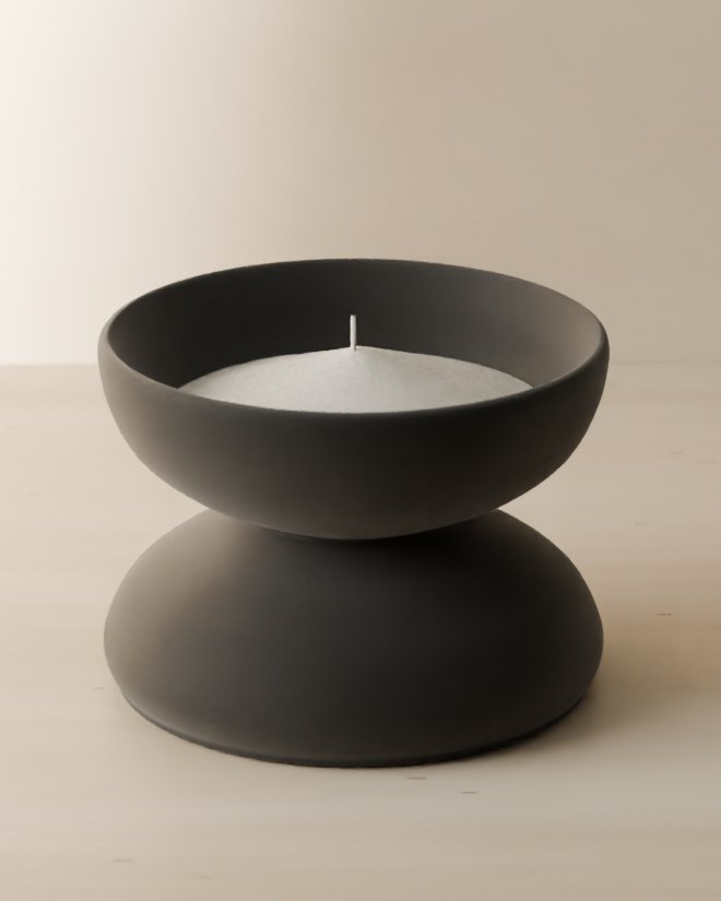 A wick standing in the centre of the pearls